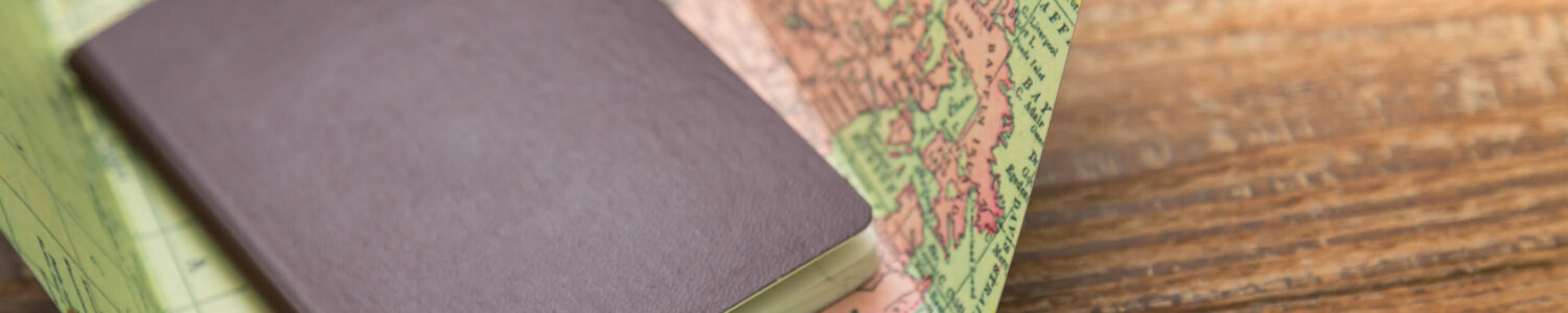 Blank passport with Map on wood table