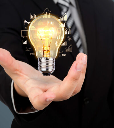 Business man holding light bulb Business man holding light bulb