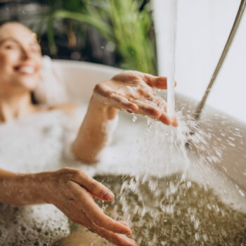 Woman relaxing in bath with bubbles Woman relaxing in bath with bubbles
